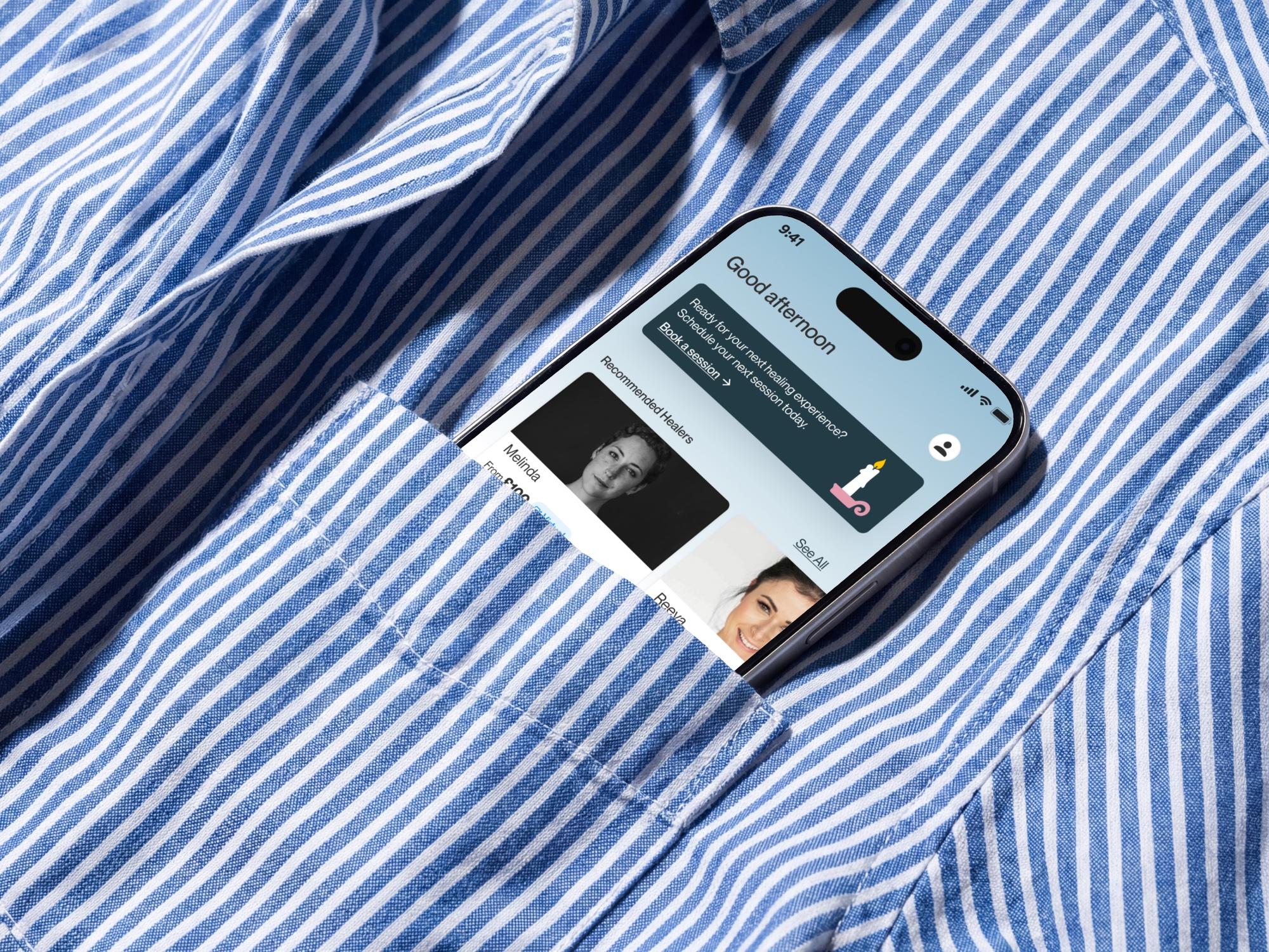 OOMA home screen on a phone in a shirt pocket